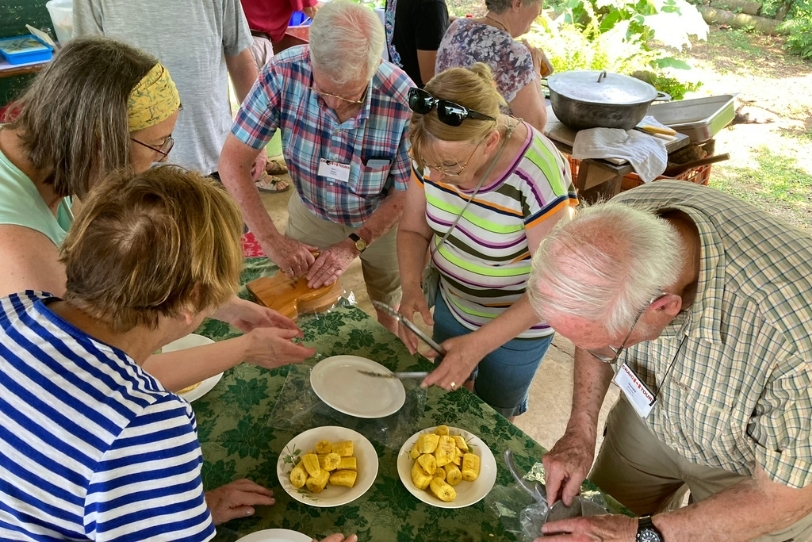 Travellers preparing a traditional meal during a Cooking with Locals experience in Costa Rica.