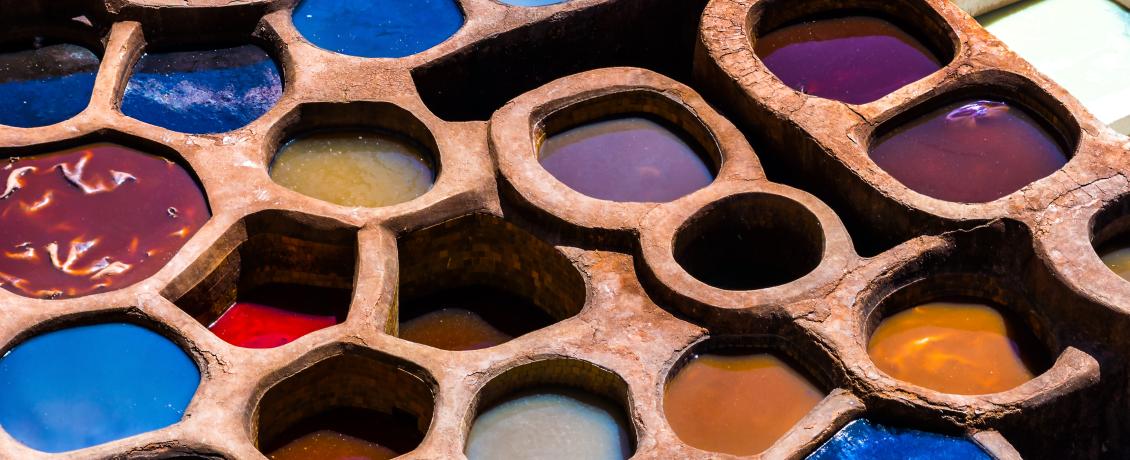 Tanning pits in filled with colourful leather dyes in Fez