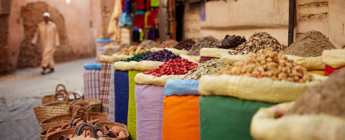 Brightly coloured bags filled with Moroccan spices in a souk