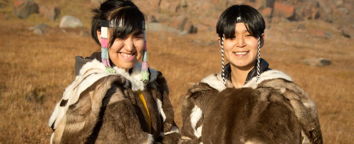 Two Inuit women in traditional fur clothing