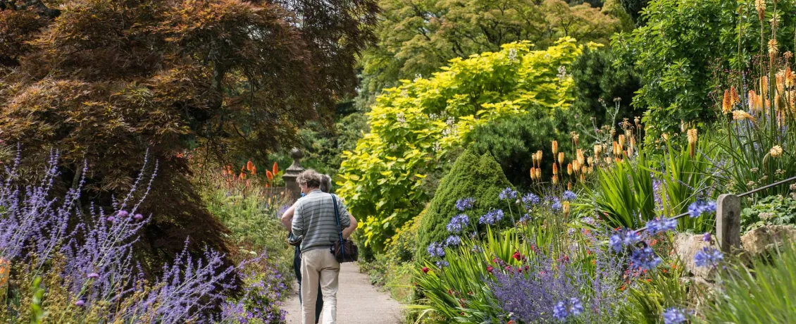 Two seniors walking in Borde Hill.