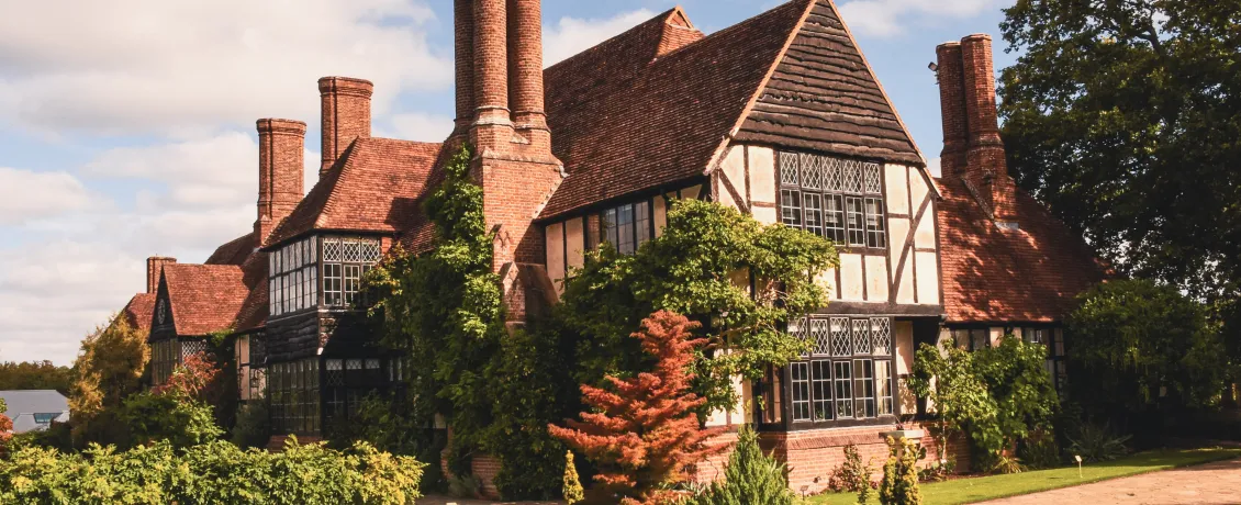 Golden light over the historic Laboratory at RHS Garden Wisley