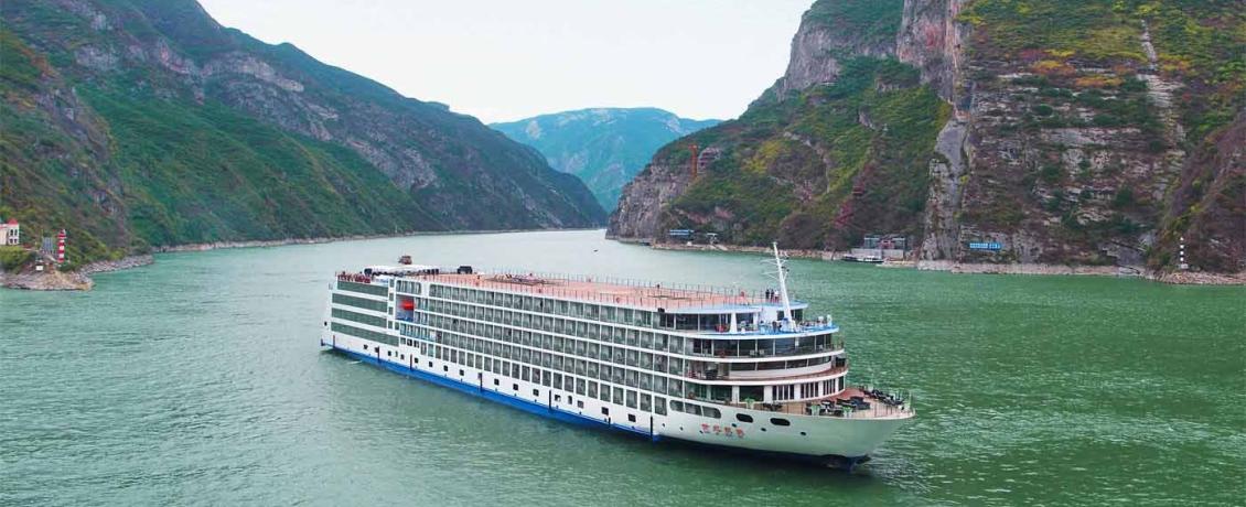 River cruise ship sailing through the Yangtze River gorges in China